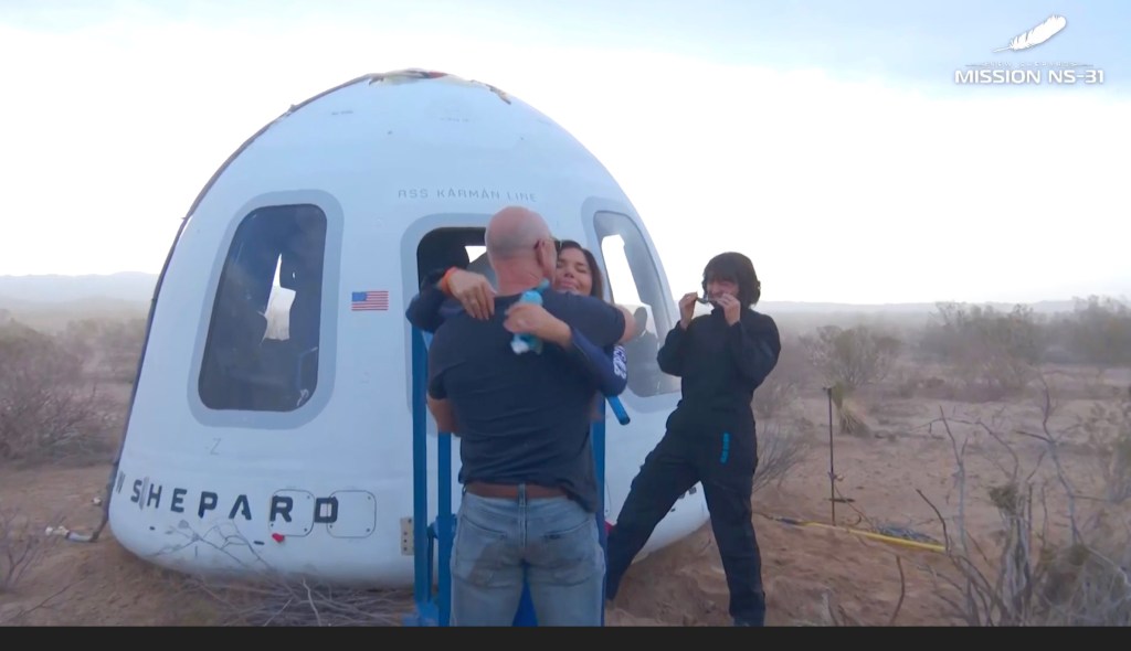 Bezos greets Sanchez after the Blue Origin flight.