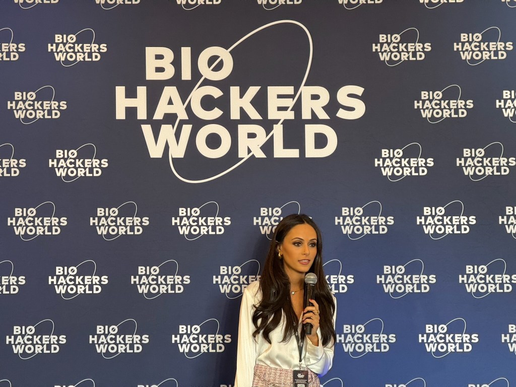Ash has nagging injuries from a car crash about three years ago, so her routine focuses on restoration. She's pictured here onstage at the Biohackers World conference.