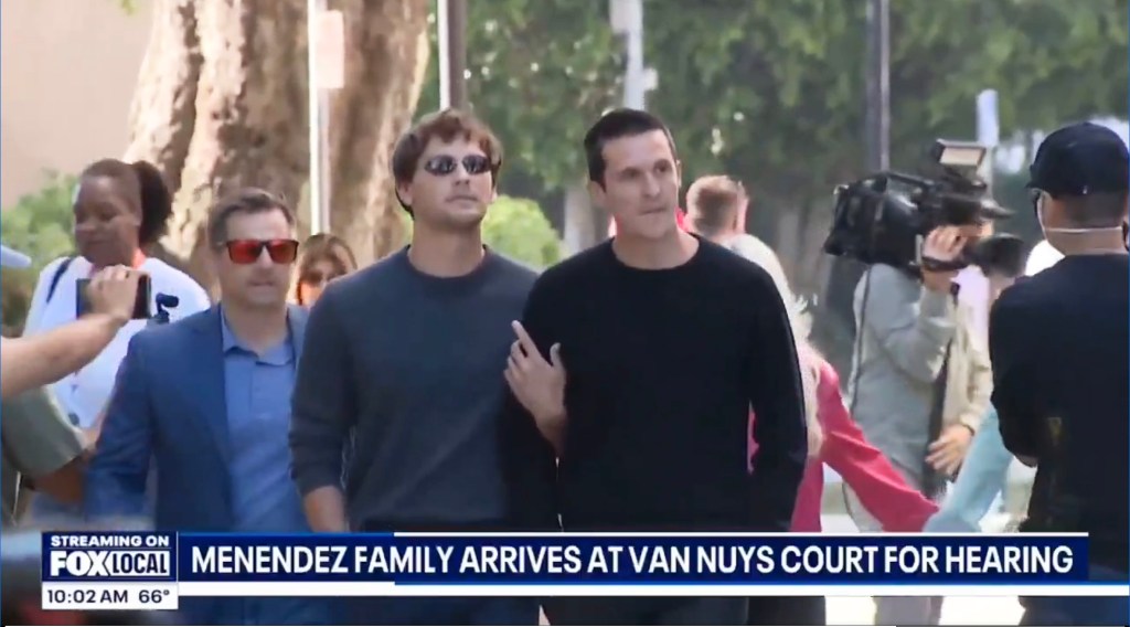Cooper Koch and Stuart McClave attending the resentencing hearing for Menendez brothers, walking down a street together