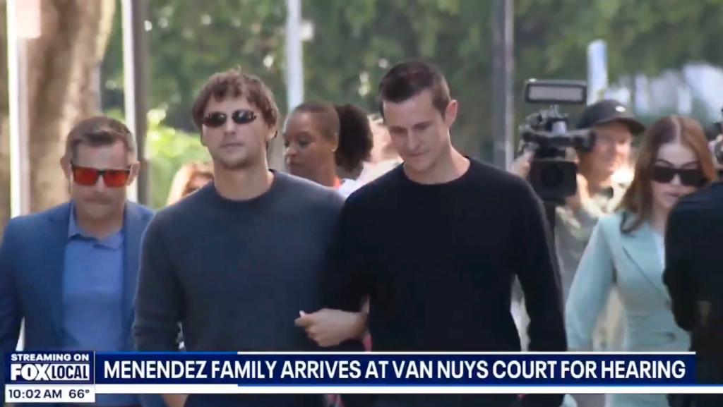 Cooper Koch and Stuart McClave attending Menendez brothers resentencing hearing, walking down a street