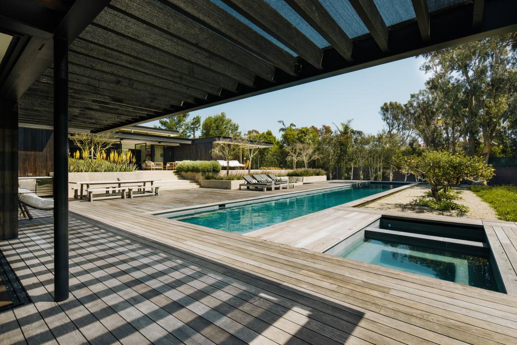 The backyard features a lap pool and a jacuzzi.