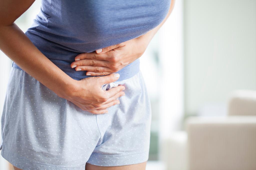 A woman having a painful stomach ache. 