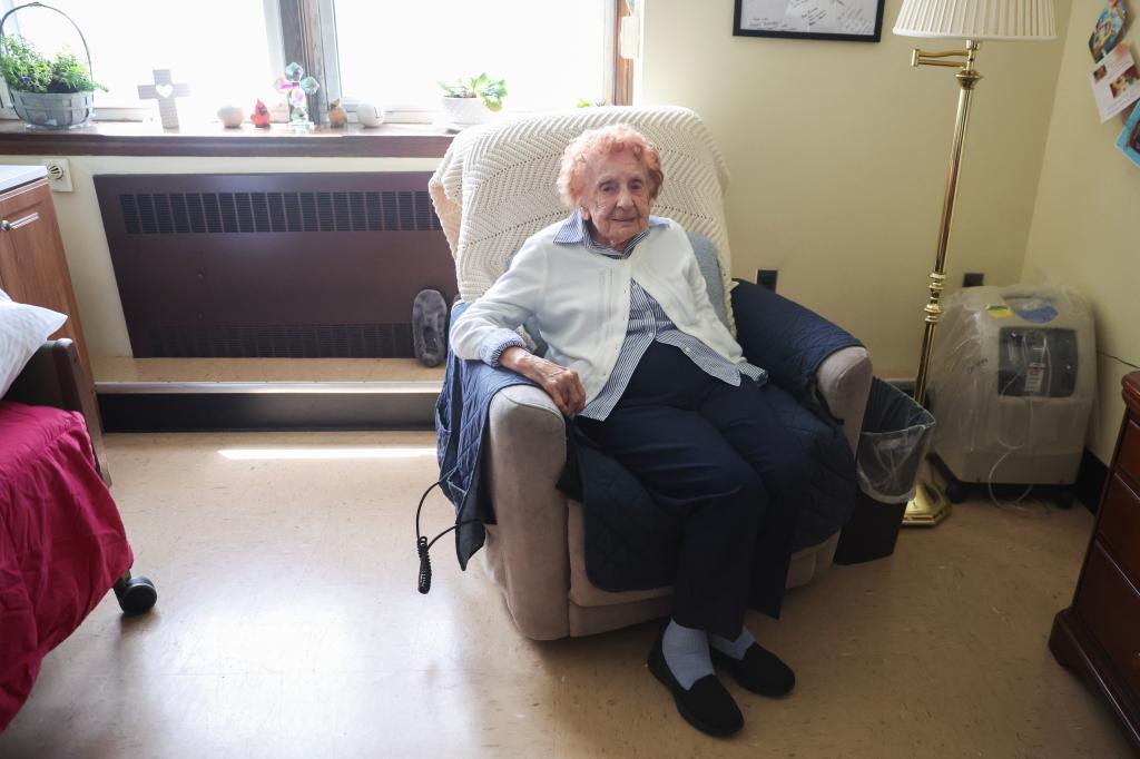 Sister Francis D. Piscatella, the world's oldest nun at 112 years old, posing for a portrait in her room at the Sisters of St. Dominic of Amityville