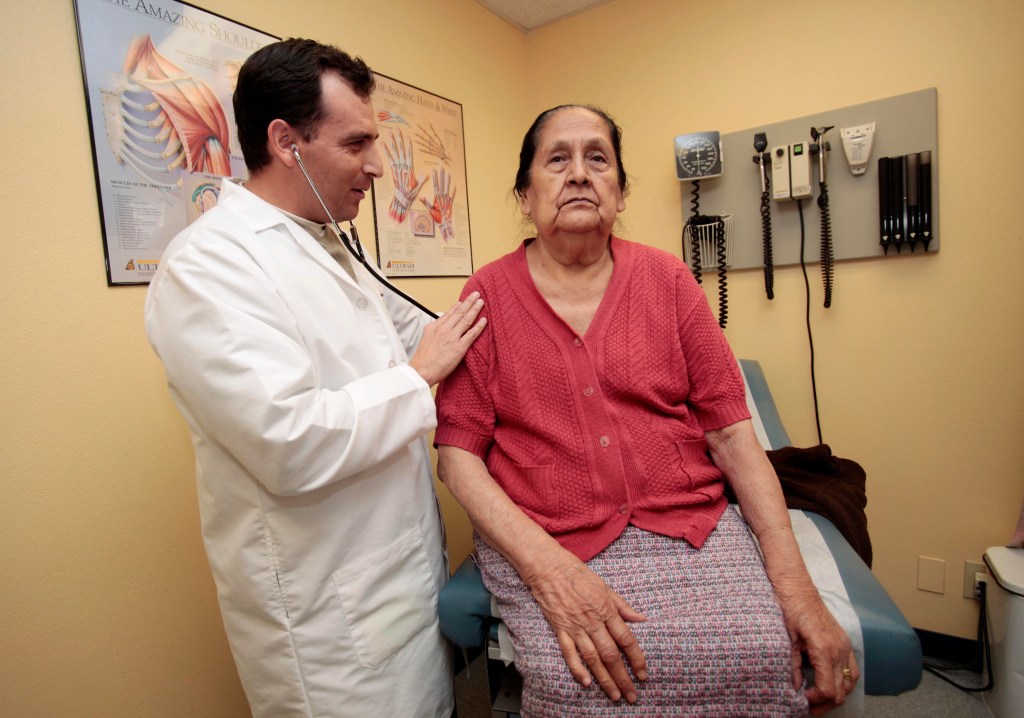 Dr. Carlos Ruvalcaba examining patient Paula Medrano, an undocumented immigrant, at the Clinica Sierra Vista Elm unit in Fresno, California in 2010.