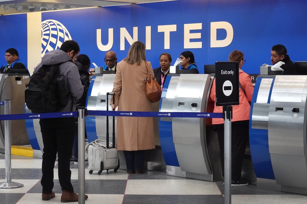 Passengers checking in for United Airlines flights at O'Hare International Airport in Chicago, Illinois on January 23, 2024, amidst company's forecasted 1st quarter loss.