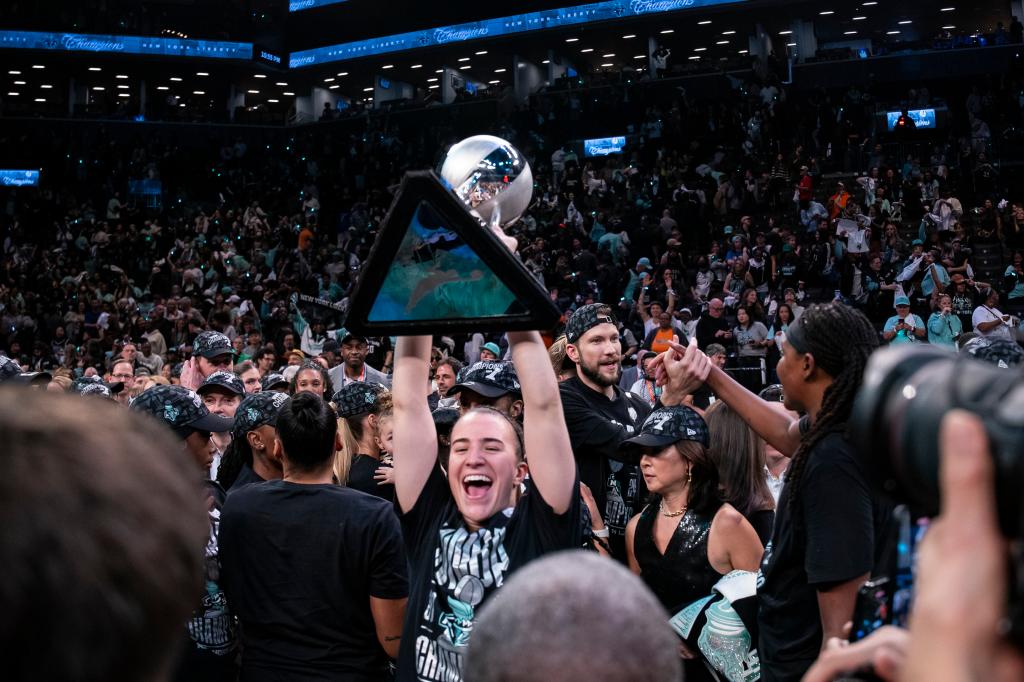Sabrina Ionescu #20 of the New York Liberty celebrates as the New York Liberty defeat Minnesota Lynx during Game 5 of the 2024 WNBA Finals to win their first championship.