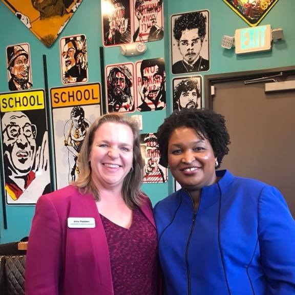 Amy Padden and Stacey Abrams stand for a picture in a photo from 2022.