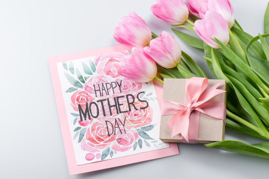 Beautiful pink tulips with a Happy Mother's Day postcard and gift