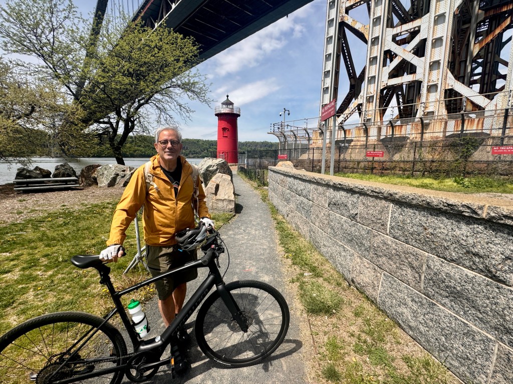 Peter Freed, videographer, 72, with his bicycle.