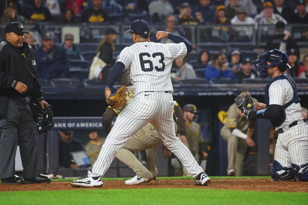 Yankees pitcher Fernando Cruz (63) celebrates San Diego Padres catcher Luis Campusano (12) being tagged out at home during the seventh inning when the New York Yankees played the San Diego Padres Monday, May 5, 2025.