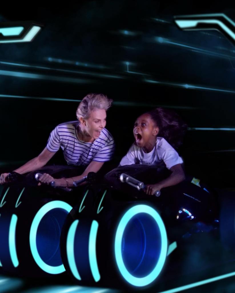 Charlize Theron on a ride with her daughter.