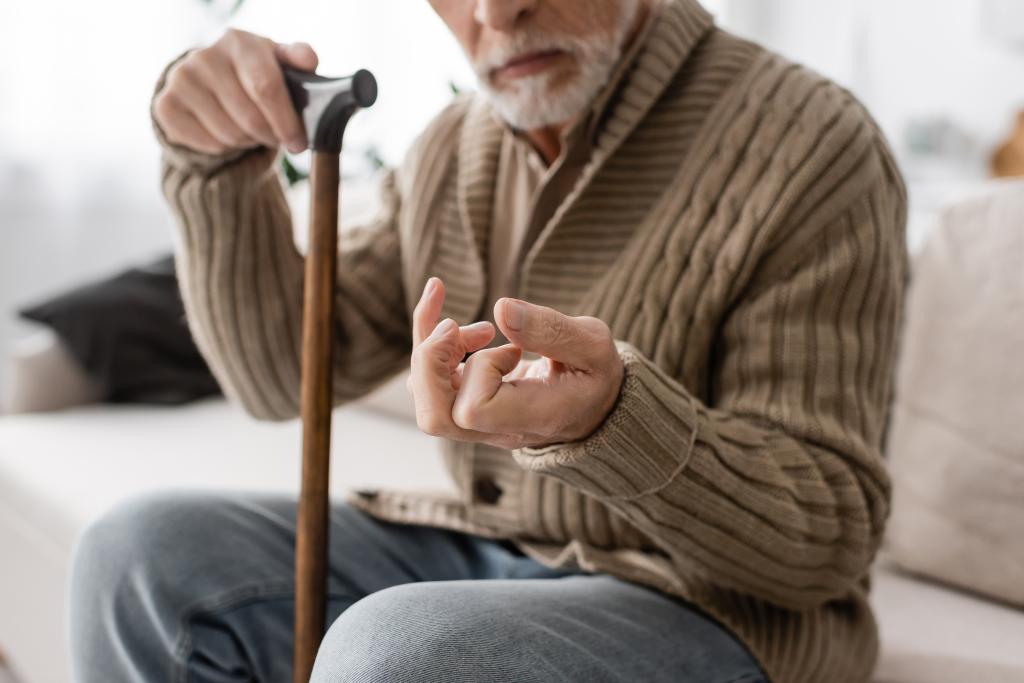 Around 90,000 new cases of Parkinson's disease are diagnosed in the US each year — the neurodegenerative disorder is commonly associated with slow movement, tremors, stiffness and difficulty walking. Here, a man with Parkinson's holds a cane.