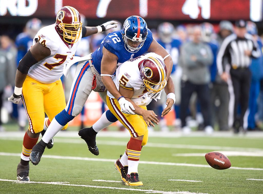Giants Osi Umenyiora sacks Redskins quarterback Donovan McNabb during the third quarter.