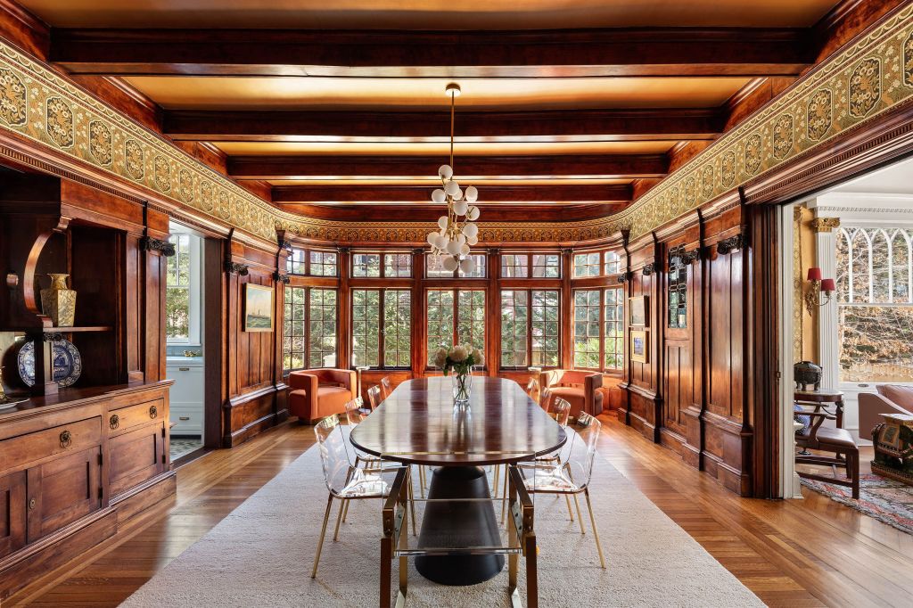 The dining room is lined with rich mahogany.