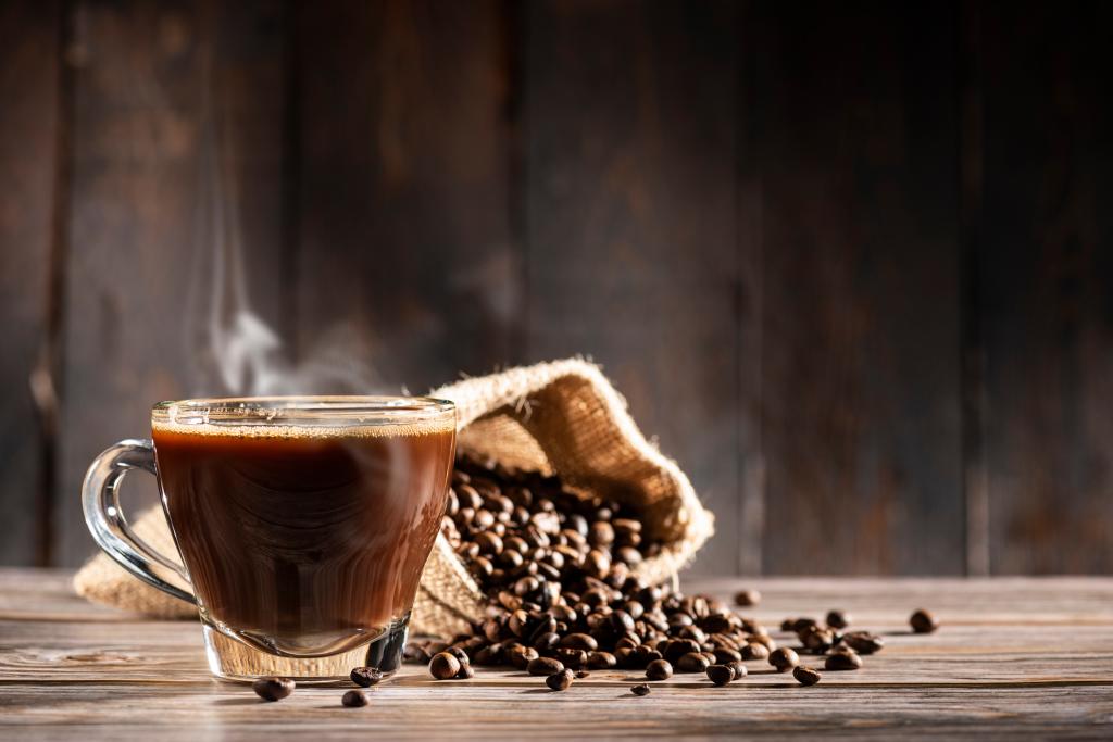 glass cup full of steamed coffee 