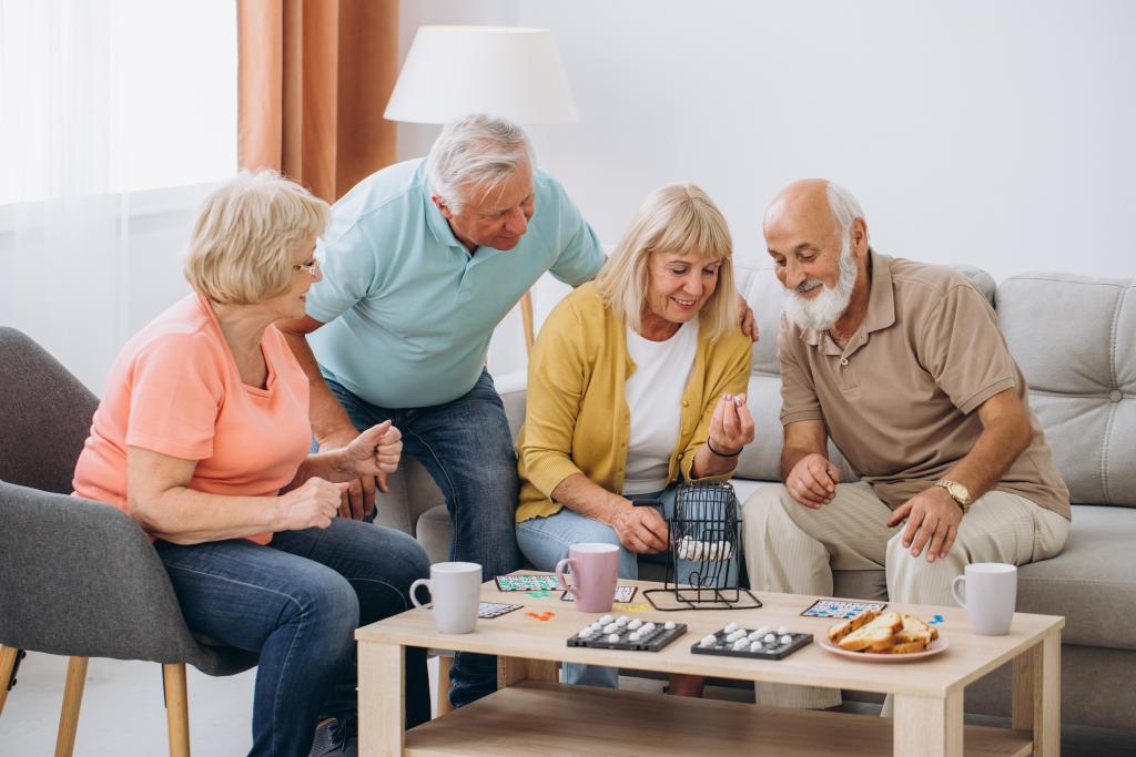 A new study suggests that a curious mind may actually help reduce dementia risk. Here, a group of seniors plays a game.
