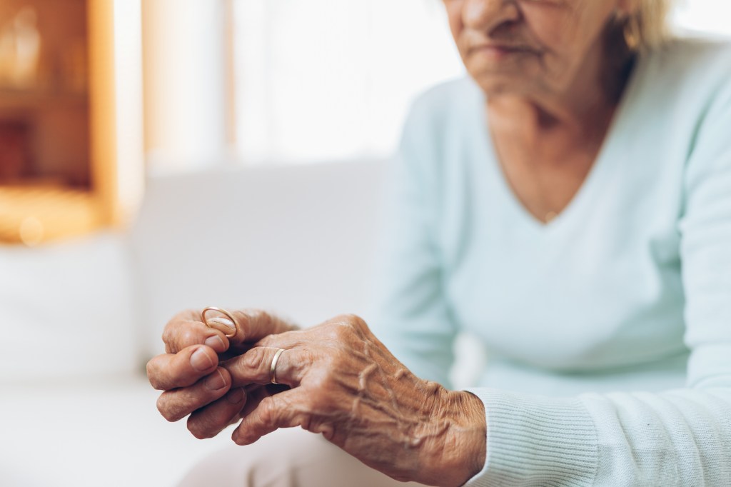 A study out of Norway indicated that grip strength in people in their 80s and 90s may predict their likelihood of becoming a centenarian. Here, an elderly woman examines her hands.