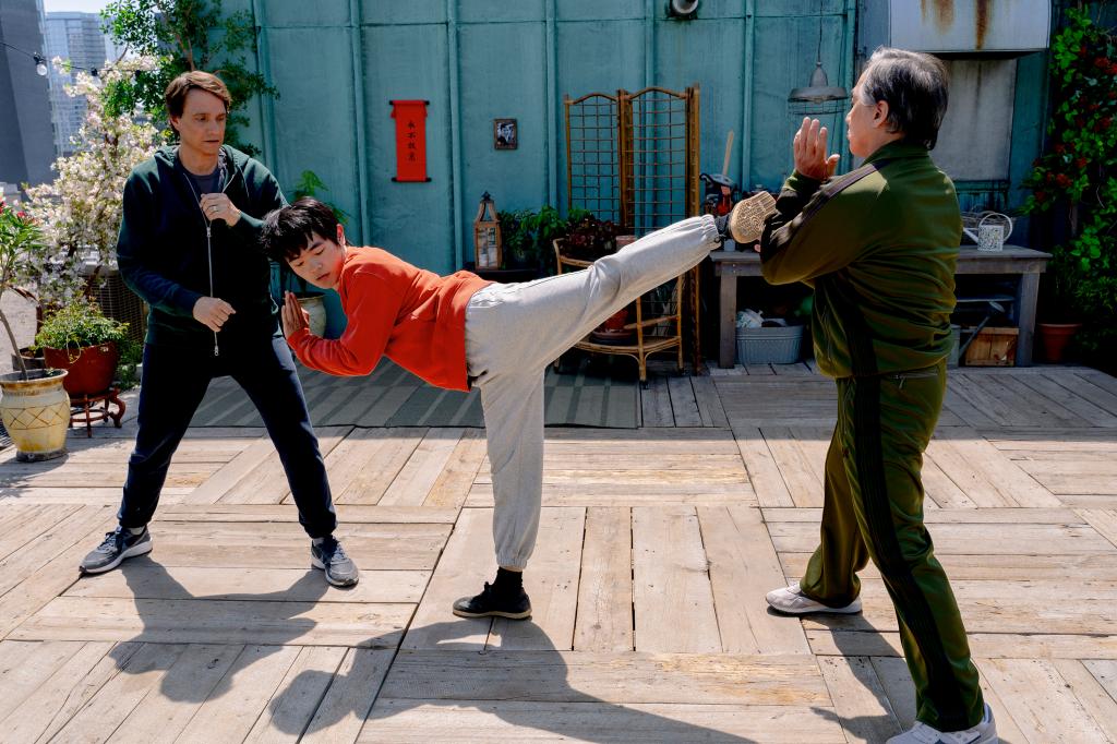 Ralph Macchio, Ben Wang, and Jackie Chan in a scene from 'Karate Kid: Legends' by Sony Pictures