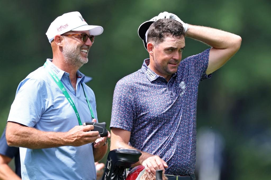 Keegan Bradley talks with his caddie Scott Vail during a practice round at the PGA Championship on May 14, 2025.