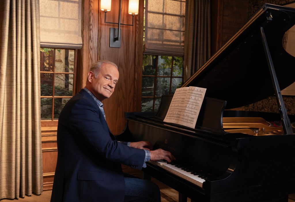 Kelsey Grammer playing a baby grand piano.