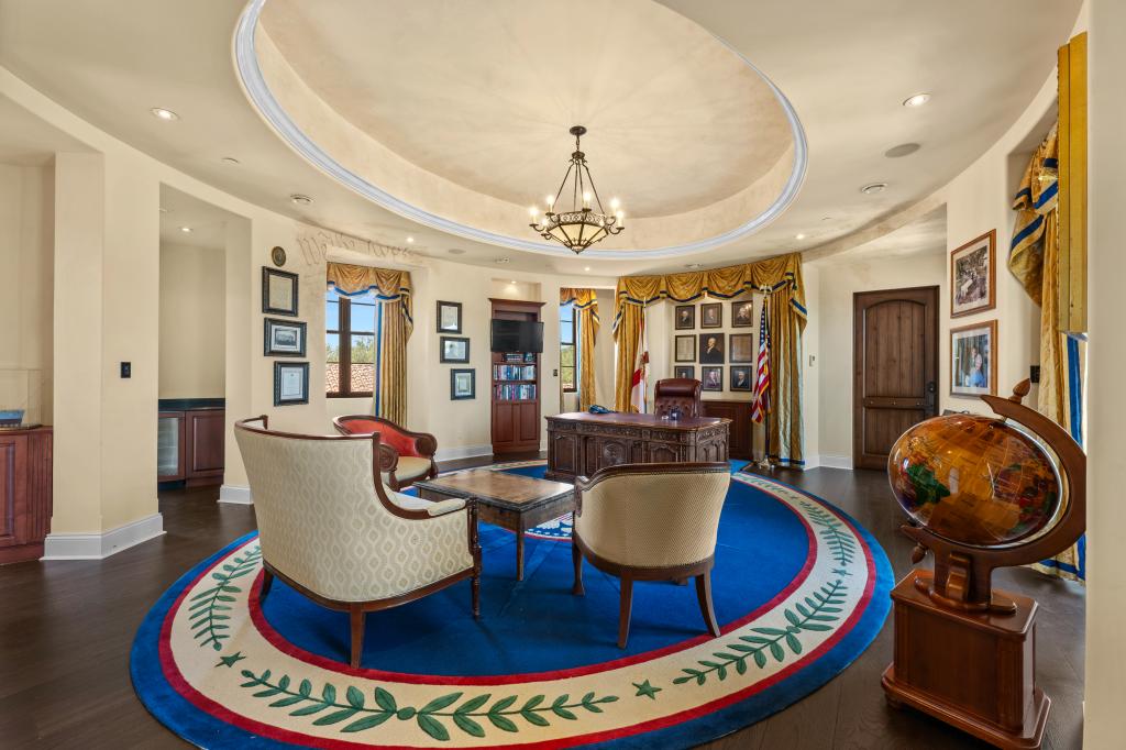 The office features a replica with a “National Treasure” film prop desk.