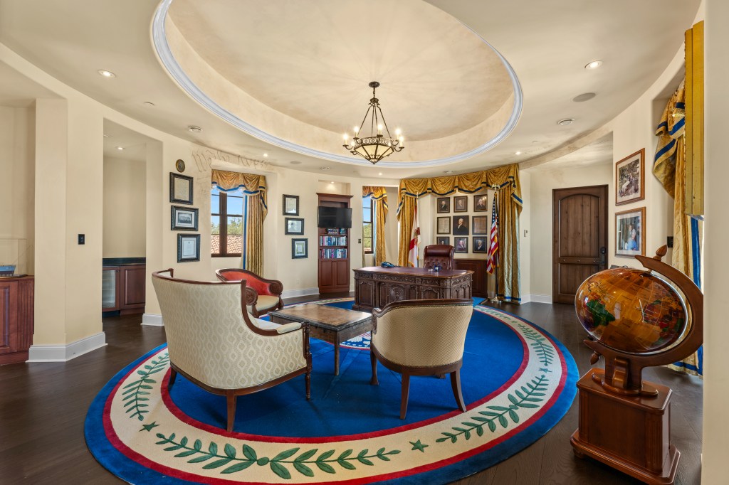 The office features a replica with a “National Treasure” film prop desk.