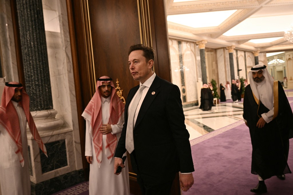 Senior Advisor to the US President Elon Musk (R) leaves after a bilateral meeting in Riyadh on May 13, 2025.