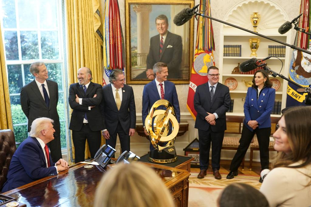 Michigan Governor Gretchen Whitmer speaks next to Michigan House Speaker Matt Hall, on the day U.S. President Donald Trump signs executive orders and proclamations, in the Oval Office at the White House in Washington, D.C., U.S., April 9, 2025. REUTERS/Nathan Howard
