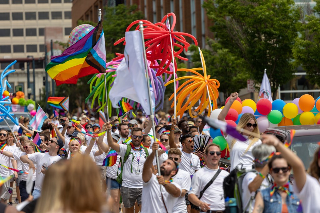 People are seen as they participate in the 2022 LGBTQ Pride Parade in downtown Cincinnati, Ohio, Saturday, June 25, 2022. 