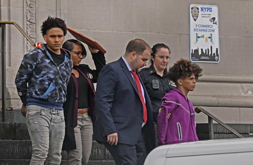 Two members of the Venezuelan gang called "Diablos de las 42" (which means Devils of 42nd Street,) were brought out of the 120th Precinct of the NYPD to face criminal charges for second degree robbery. (pictured, blue camo shirt and purple sweatshirt) The kid in the purple sweatshirt is named Eli Rangel, and the kid in the blue camo shirt is named (still need this boy's name). Allegedly, these two kids robbed a 16 year old autistic boy at the Staten Island Mall. They are thought to be a mini gang that is part of a larger gang from Venezeula called the Tren de Aragua. 78 Richmond Terrace, Staten Island, NY. 
