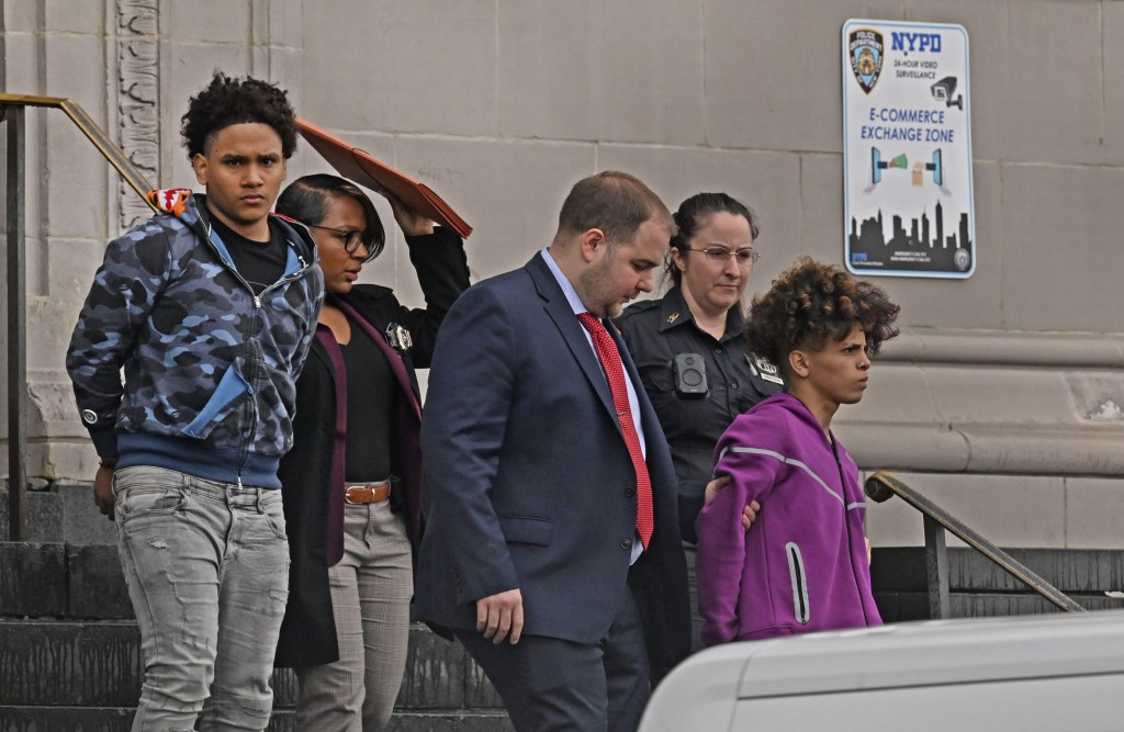 Two members of the Venezuelan gang called "Diablos de las 42" (which means Devils of 42nd Street,) were brought out of the 120th Precinct of the NYPD to face criminal charges for second degree robbery. (pictured, blue camo shirt and purple sweatshirt) The kid in the purple sweatshirt is named Eli Rangel, and the kid in the blue camo shirt is named (still need this boy's name). Allegedly, these two kids robbed a 16 year old autistic boy at the Staten Island Mall. They are thought to be a mini gang that is part of a larger gang from Venezeula called the Tren de Aragua. 78 Richmond Terrace, Staten Island, NY. 