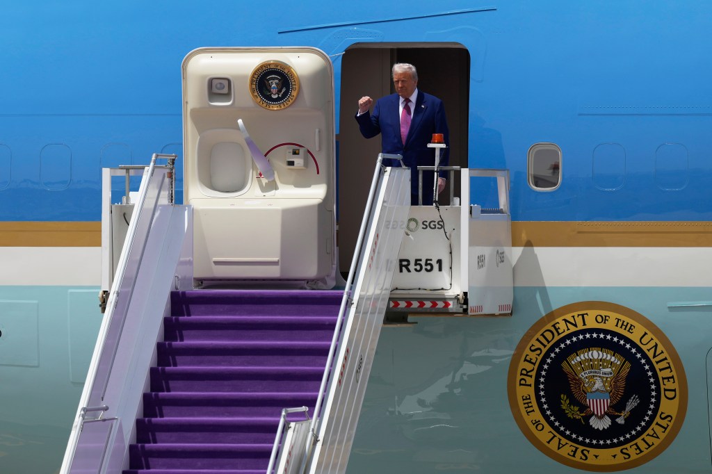 President Trump is seen above arriving in Riyadh, Saudi Arabia, on Tuesday.