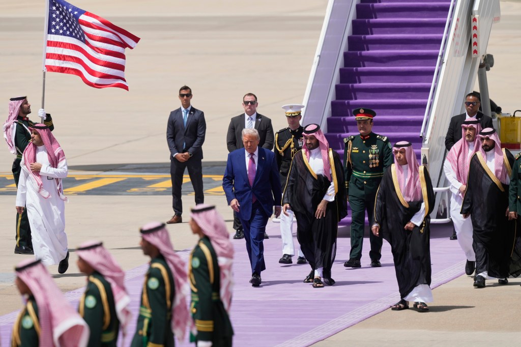 President Donald Trump walks with Saudi Crown Prince Mohammed bin Salman during an arrival ceremony at the Royal Terminal of King Khalid International Airport in Riyadh, Saudi Arabia, Tuesday, May 13, 2025