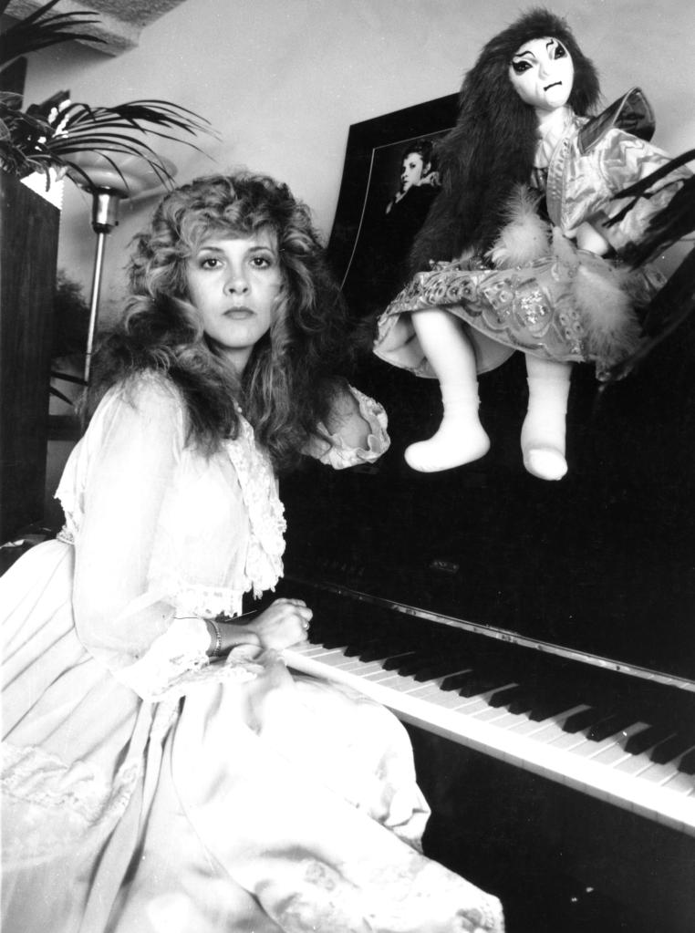 Stevie Nicks sitting at her piano in the condo. 