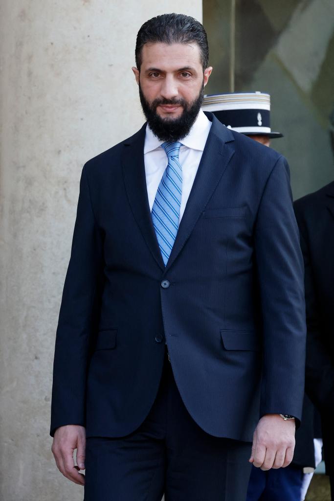Syrian President Ahmed al-Sharaa looks on as he leaves after a joint press conference with French President following a meeting at the Elysee Palace in Paris, on May 7, 2025. 