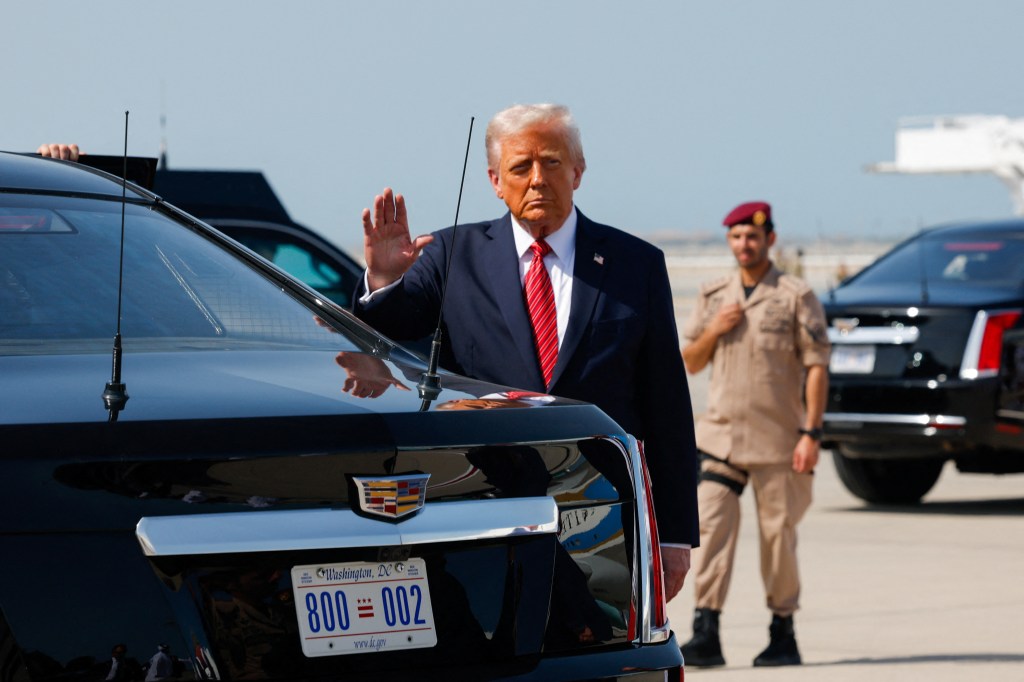 President Trump at Hamad International Airport, in Doha, Qatar, May 14, 2025. Trump gestures upon his arrival at Hamad International Airport, in Doha, Qatar, May 14, 2025.