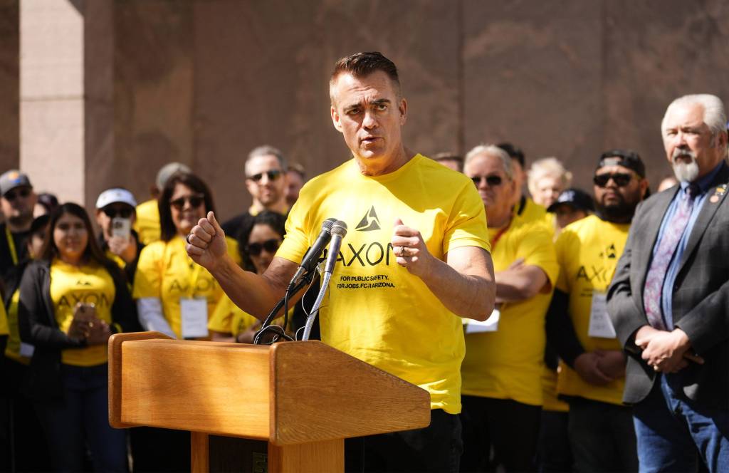 Axon CEO Rick Smith addresses Axon employees and lawmakers during a rally at the Arizona state Capitol in Phoenix on March 4, 2025