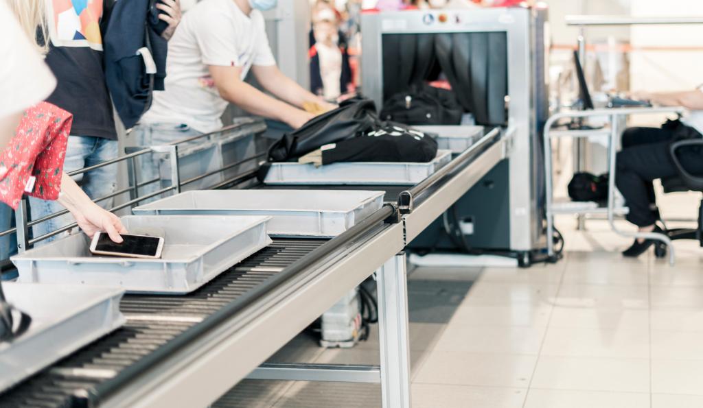 A baggage inspection system representing security and safety concepts.