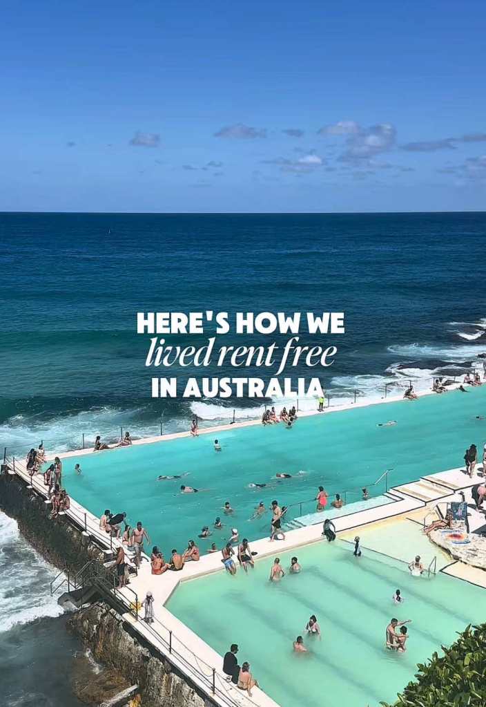 A young couple smiling, sharing their story of living rent-free while traveling across Australia using a pet-sitting platform.